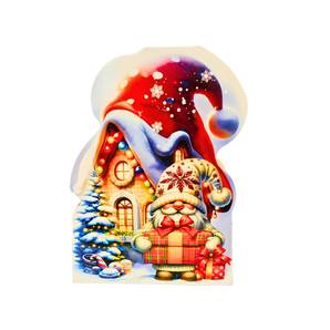 Kalėdinė dovanėlė „Seneliuko Nameliukas“ su 258 g saldumynų ir dėlione viduje.